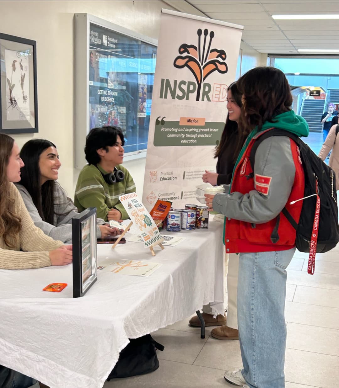 Team members holding donation signs